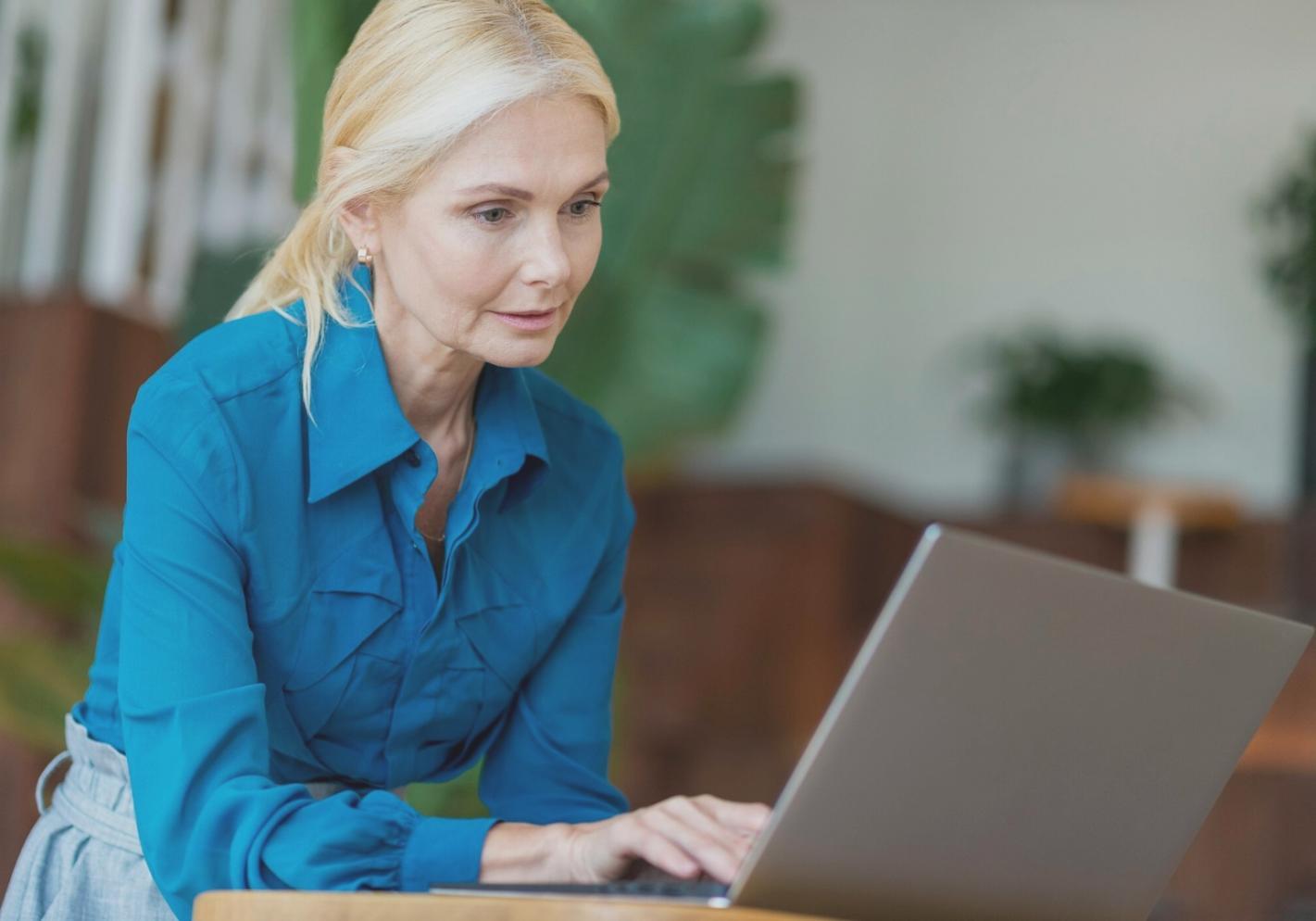 Student working on financial planning spreadsheet during evening class session